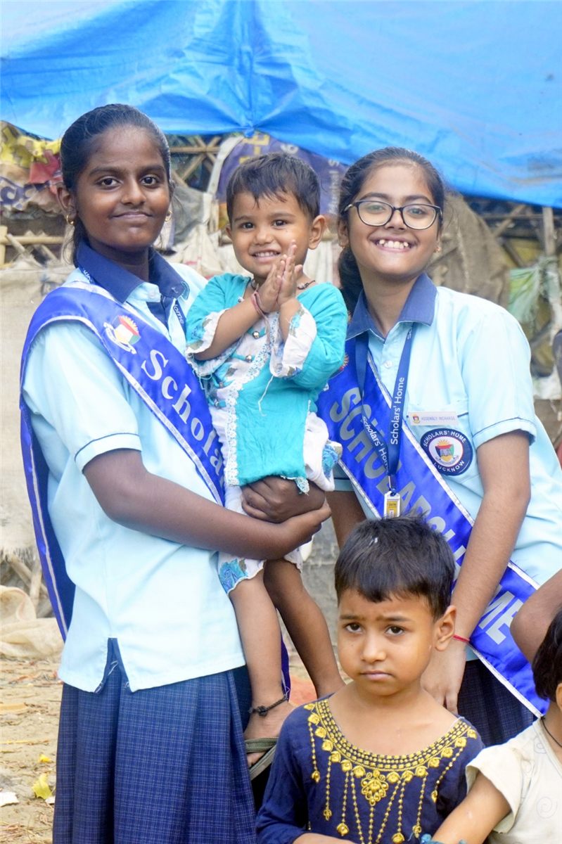 Scholars' Home students on a community service drive, caring for younger children