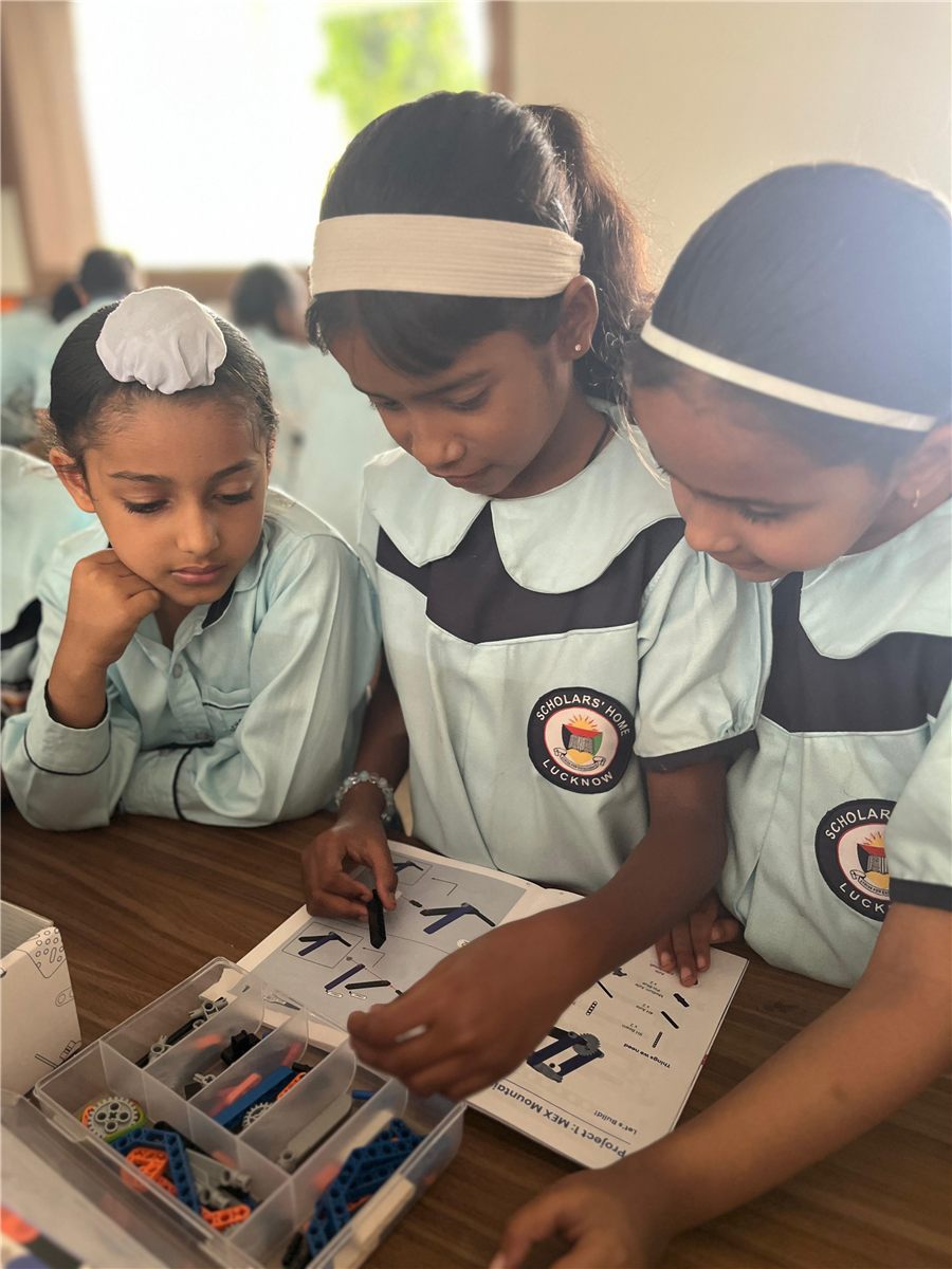 Students building a robot at the Scholars' Home Robotics & AI Lab, Lucknow
